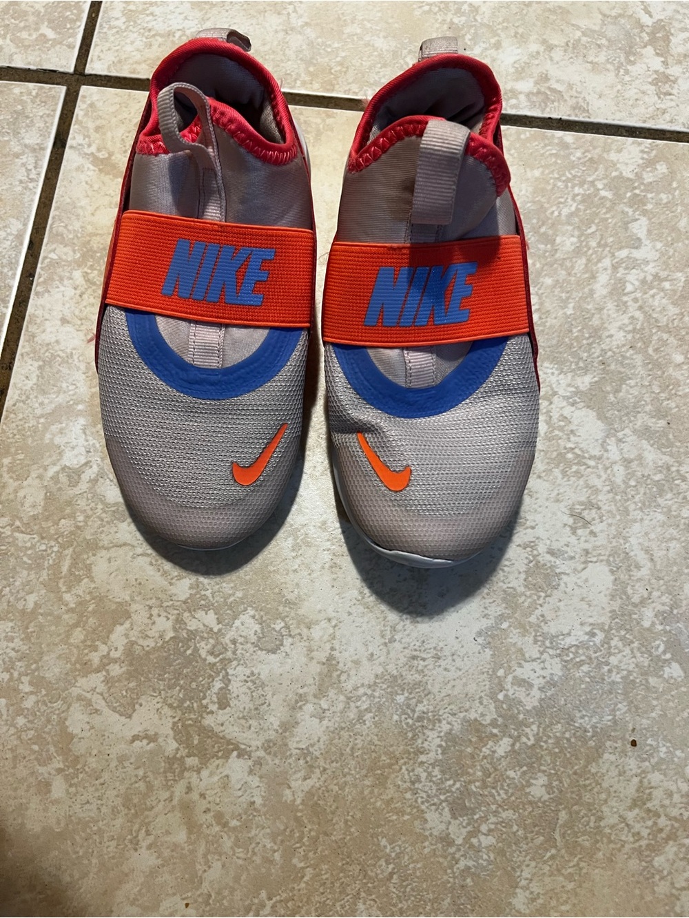 Nike Kids Slip-On Athletic Shoes in Gray with Orange and Blue Accents